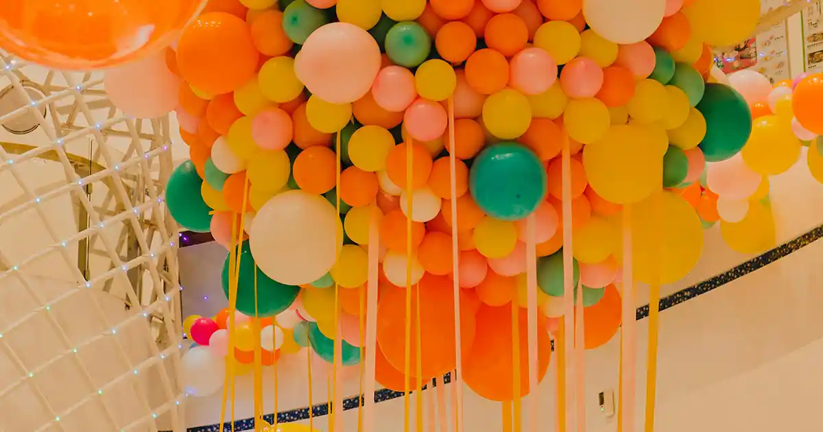 Massive Funsational balloon installation at a large venue with hundreds of balloons