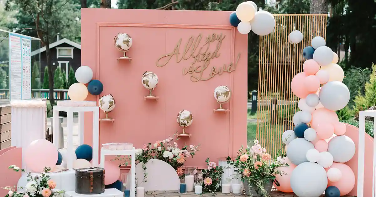 Elegant white and gold Prima balloon installation at a wedding reception venue