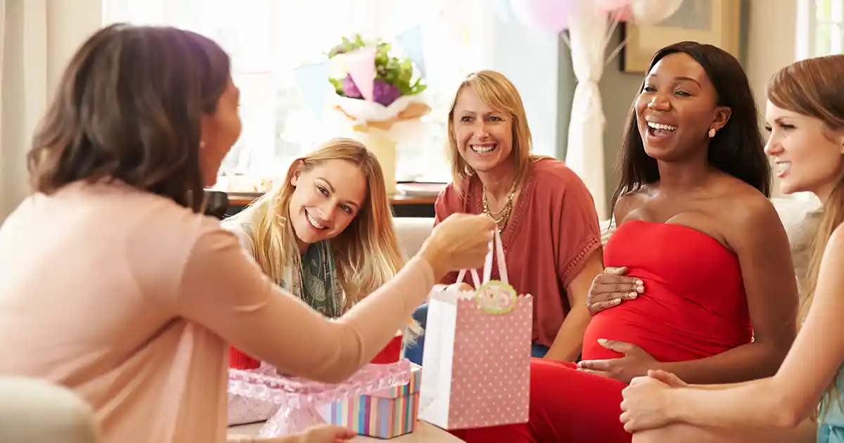 Soft pastel Sempertex balloon garland in blush and sage for a baby shower